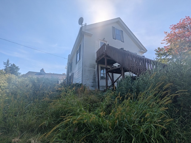 view of home's exterior with a deck