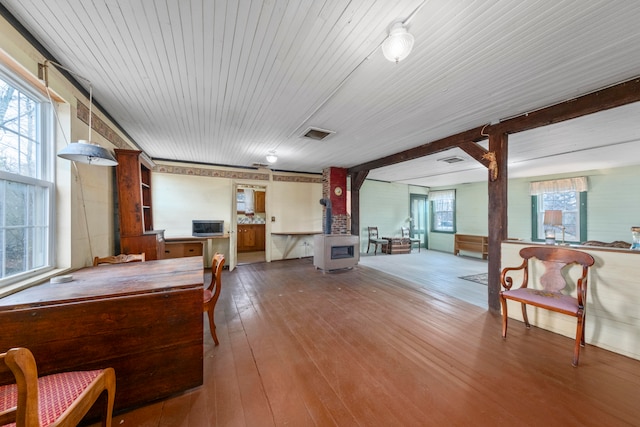 rec room featuring wood-type flooring and heating unit