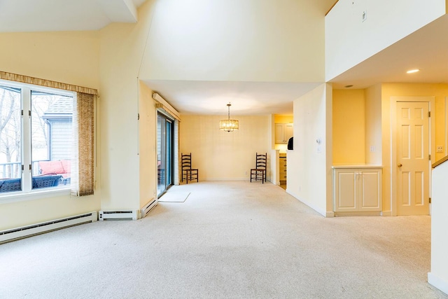 9 Jameson Point Rd Unit 10, Rockland, ME 04841 - carpeted empty room featuring a towering ceiling, a chandelier, and recessed lighting