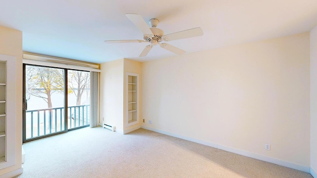 9 Jameson Point Rd Unit 10, Rockland, ME 04841 - spare room featuring light carpet, ceiling fan, and a baseboard radiator