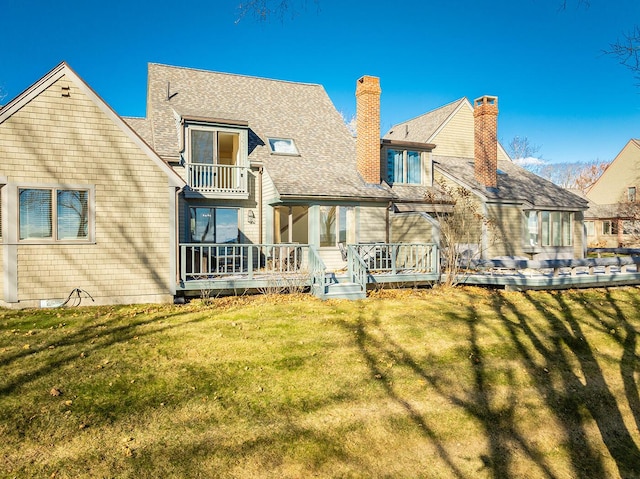 9 Jameson Point Rd Unit 10, Rockland, ME 04841 - back of property featuring a chimney, a lawn, a balcony, and a shingled roof