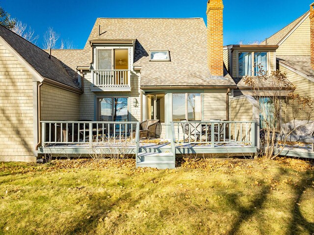 9 Jameson Point Rd Unit 10, Rockland, ME 04841 - back of house featuring a shingled roof, a chimney, a lawn, and a balcony