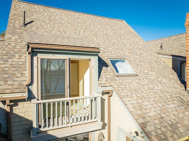 9 Jameson Point Rd Unit 10, Rockland, ME 04841 - view of side of property featuring a shingled roof and a balcony