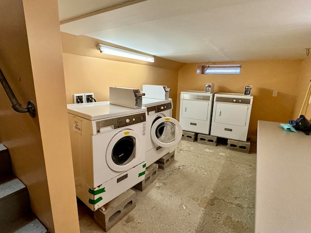 washroom with washing machine and dryer