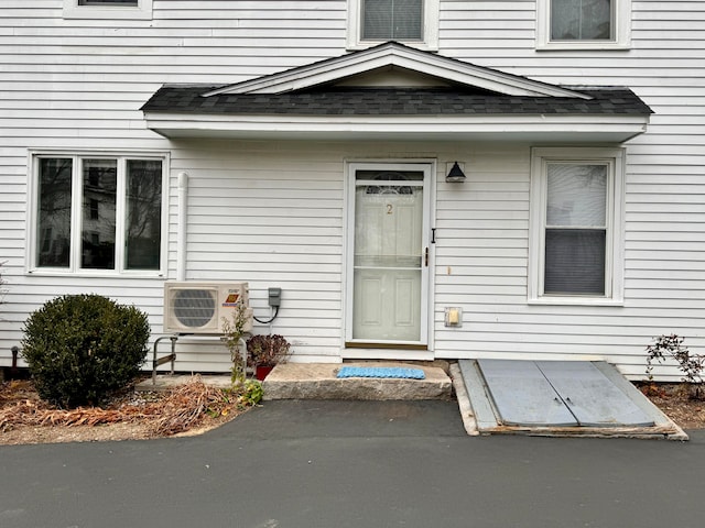 entrance to property featuring ac unit