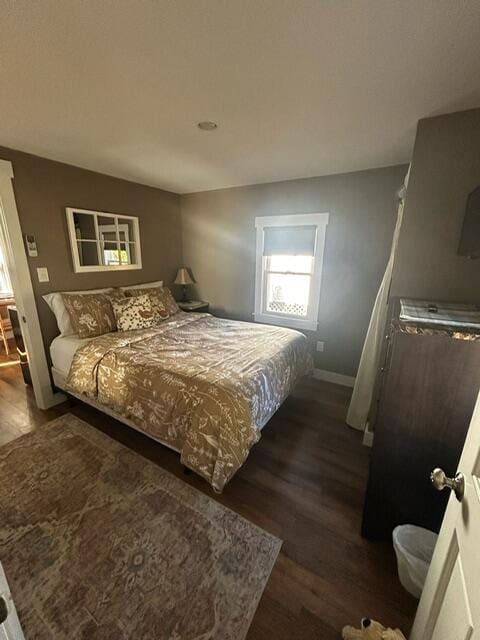 bedroom featuring dark hardwood / wood-style floors