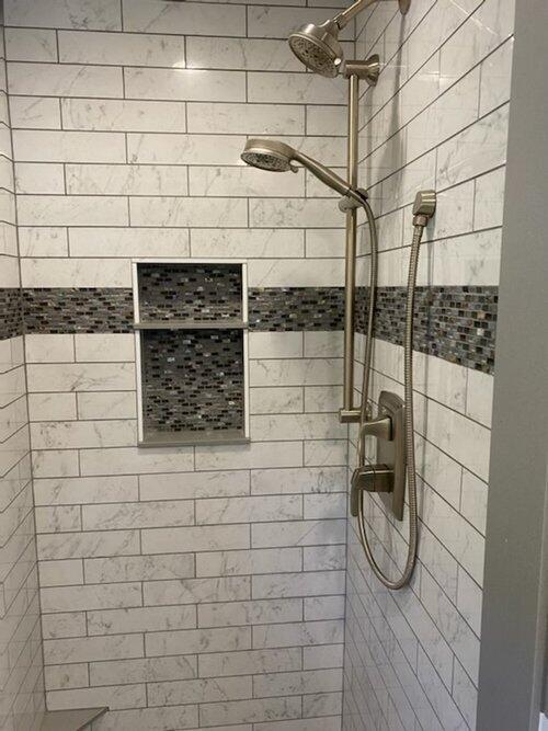 bathroom with a tile shower