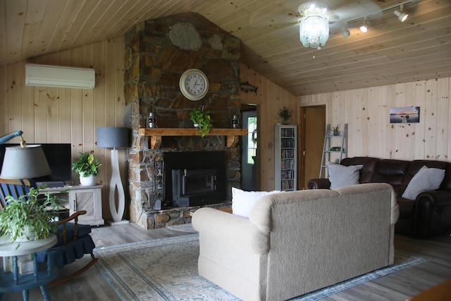47 Fickett Dr, Litchfield, ME 04350 - living room featuring a wall mounted air conditioner, vaulted ceiling, wood finished floors, wooden walls, and wooden ceiling