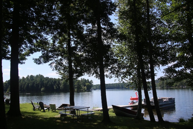 47 Fickett Dr, Litchfield, ME 04350 - water view featuring a forest and a dock