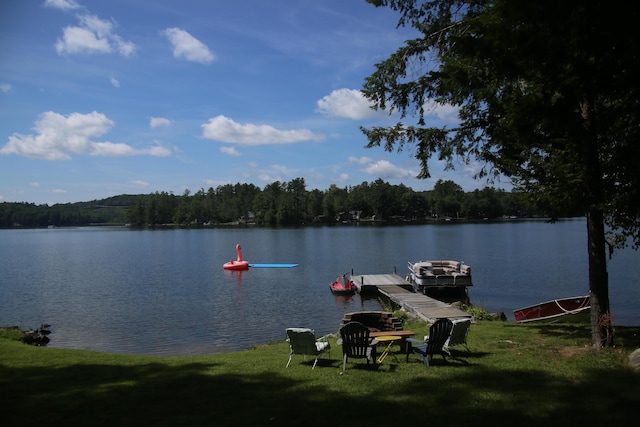 47 Fickett Dr, Litchfield, ME 04350 - dock with a water view, a forest view, and a lawn