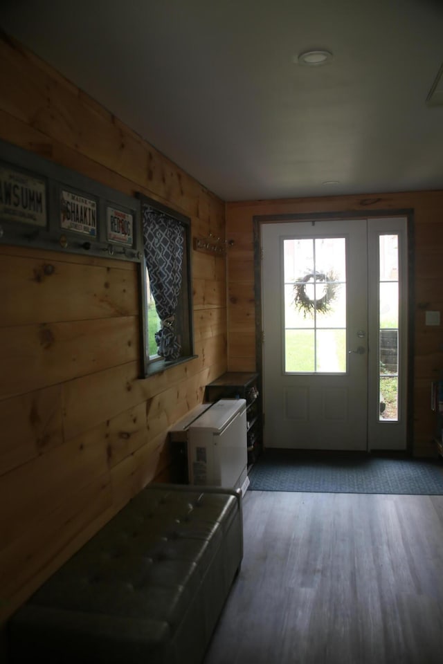 47 Fickett Dr, Litchfield, ME 04350 - entryway with wooden walls and light wood-style floors