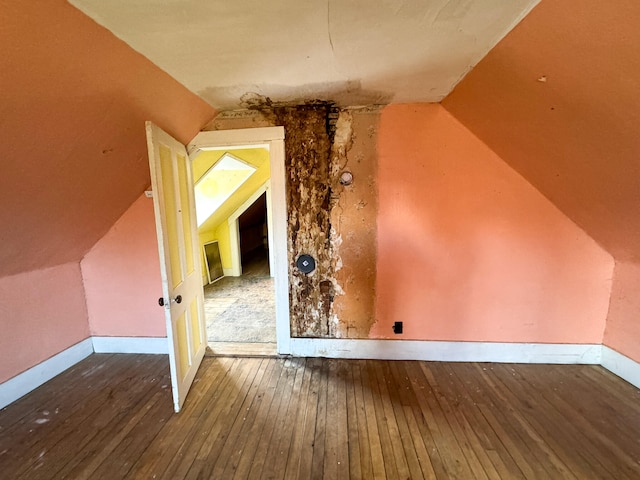 bonus room featuring hardwood / wood-style floors and lofted ceiling