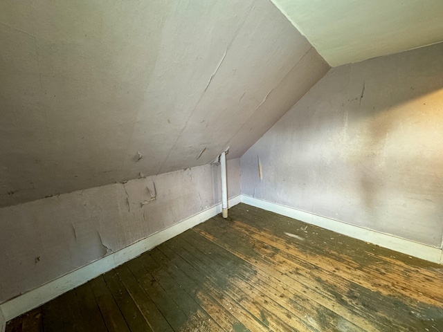 bonus room featuring dark hardwood / wood-style floors and lofted ceiling