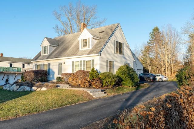 view of side of home featuring a lawn