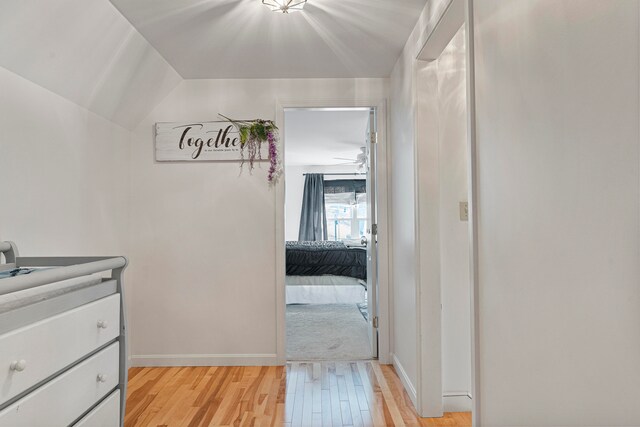 corridor with light hardwood / wood-style flooring