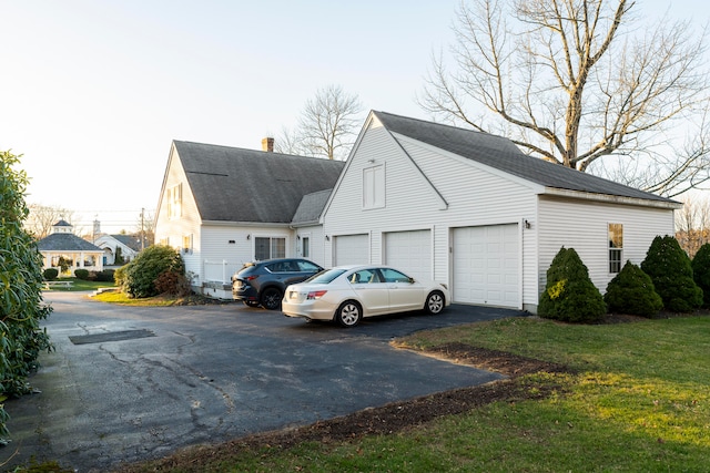 view of property exterior with a garage