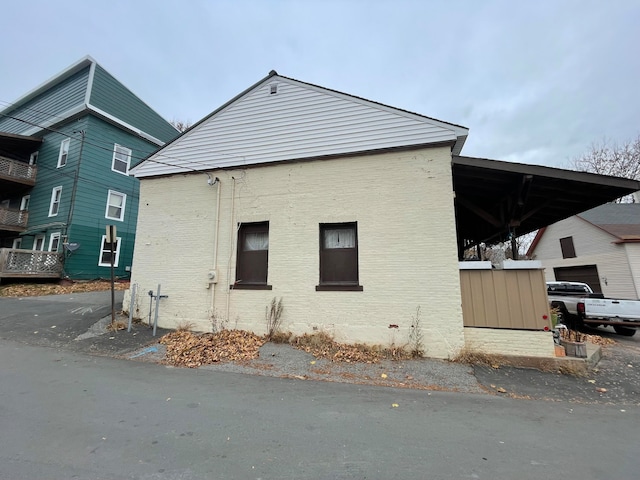 view of side of home featuring a garage