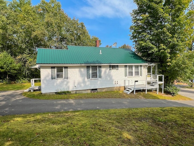 back of house with a yard