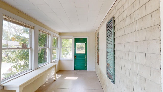 unfurnished sunroom with plenty of natural light