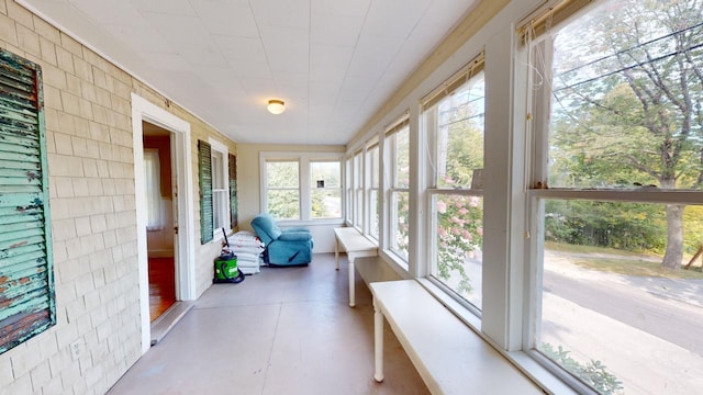 sunroom / solarium featuring plenty of natural light