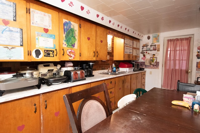 kitchen featuring backsplash and sink