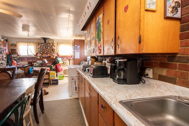 kitchen featuring tile patterned floors and sink