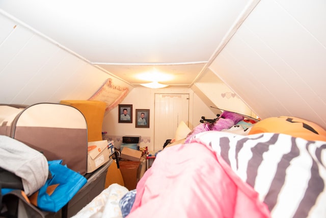 bedroom featuring lofted ceiling