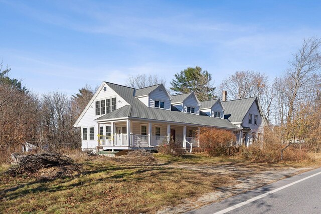 454 N Parish Rd, Turner, ME 04282 - cape cod home featuring a porch