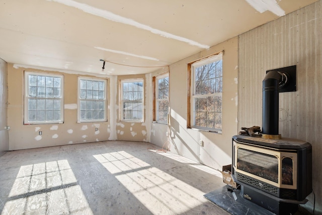 454 N Parish Rd, Turner, ME 04282 - unfurnished sunroom with a wood stove