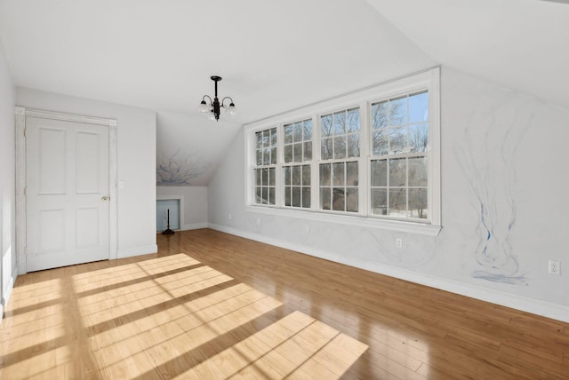 454 N Parish Rd, Turner, ME 04282 - bonus room with light hardwood / wood-style flooring, vaulted ceiling, and a notable chandelier