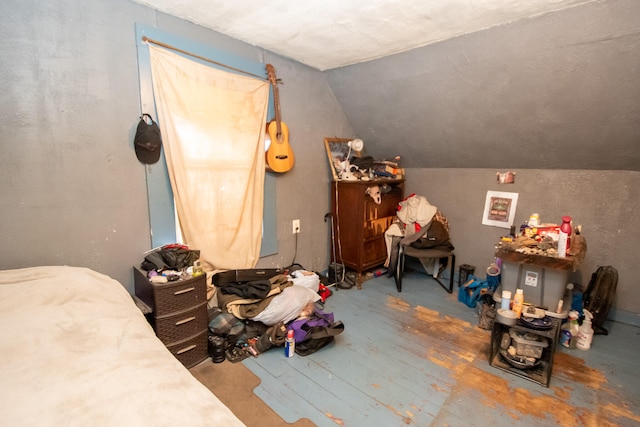 additional living space featuring hardwood / wood-style floors and vaulted ceiling