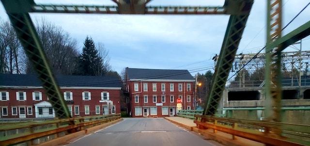 599 Plains Rd, Hollis, ME 04042 - view of asphalt road with traffic signs and curbs
