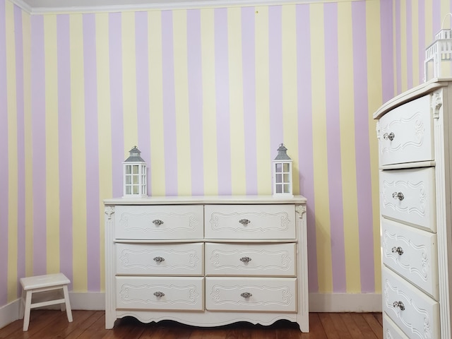 599 Plains Rd, Hollis, ME 04042 - detailed view of wood finished floors, wallpapered walls, and baseboards
