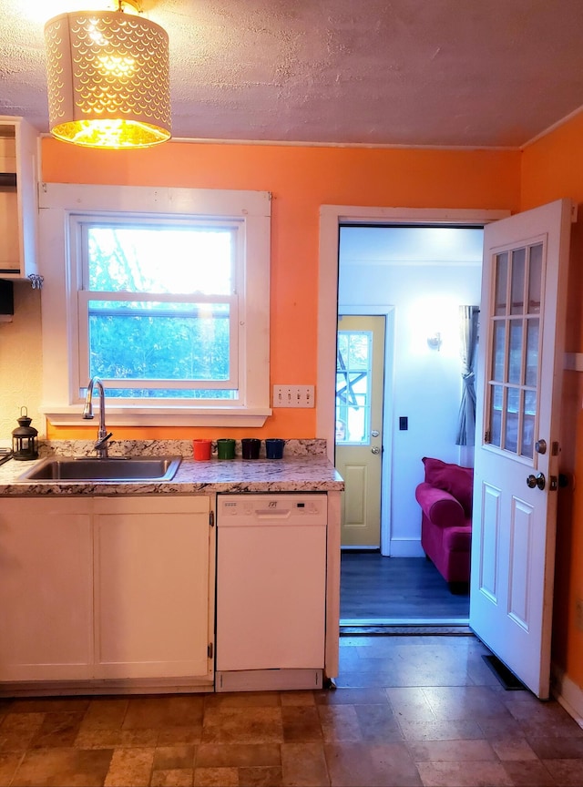 599 Plains Rd, Hollis, ME 04042 - kitchen featuring dishwasher, a sink, white cabinetry, and decorative light fixtures