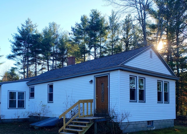 599 Plains Rd, Hollis, ME 04042 - view of front of house featuring a chimney and roof with shingles