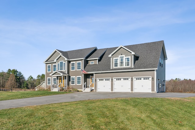 view of front of home featuring a garage and a front lawn