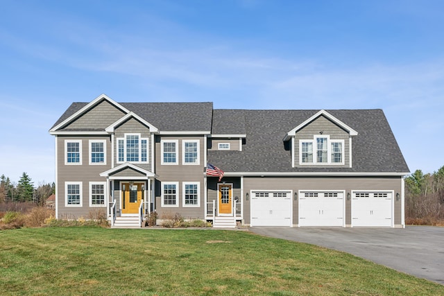 view of front of house with a front lawn and a garage