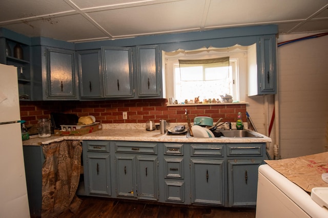 kitchen with gray cabinets, dark wood-type flooring, and white refrigerator