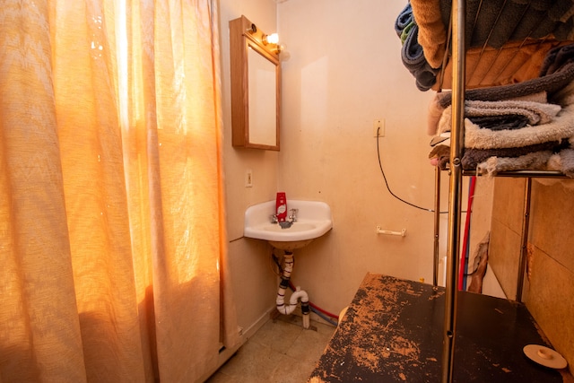 bathroom with tile patterned floors