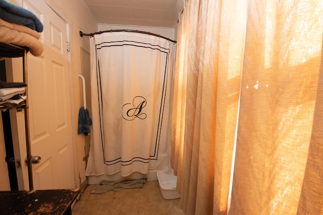 bathroom with shower / bath combination with curtain