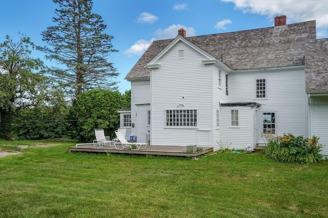 rear view of house featuring a lawn, a pergola, and a wooden deck