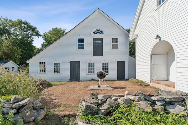 back of house featuring a patio area