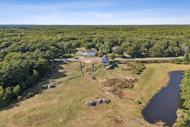 birds eye view of property with a rural view and a water view