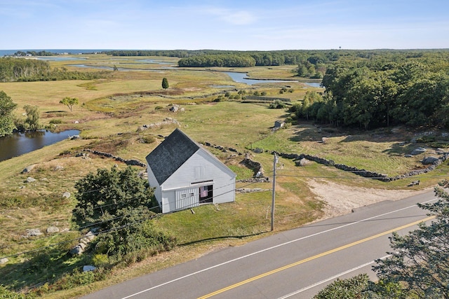 birds eye view of property with a rural view and a water view