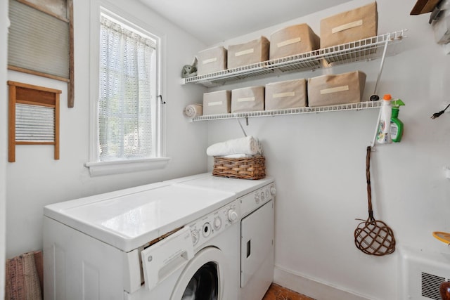 clothes washing area with washer and dryer