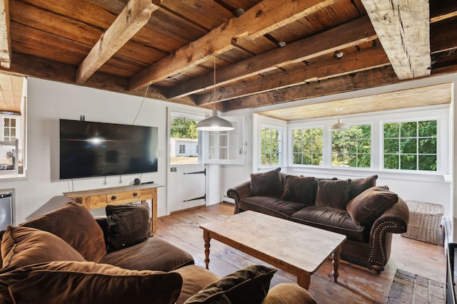 living room with beamed ceiling, light wood-type flooring, and wood ceiling