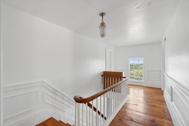 stairs with hardwood / wood-style flooring