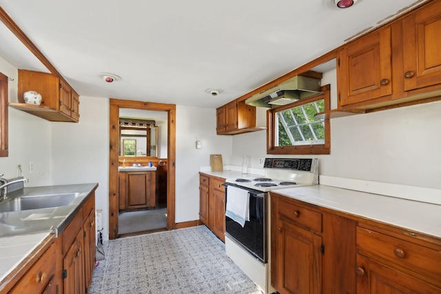 kitchen featuring ventilation hood, sink, and white electric stove