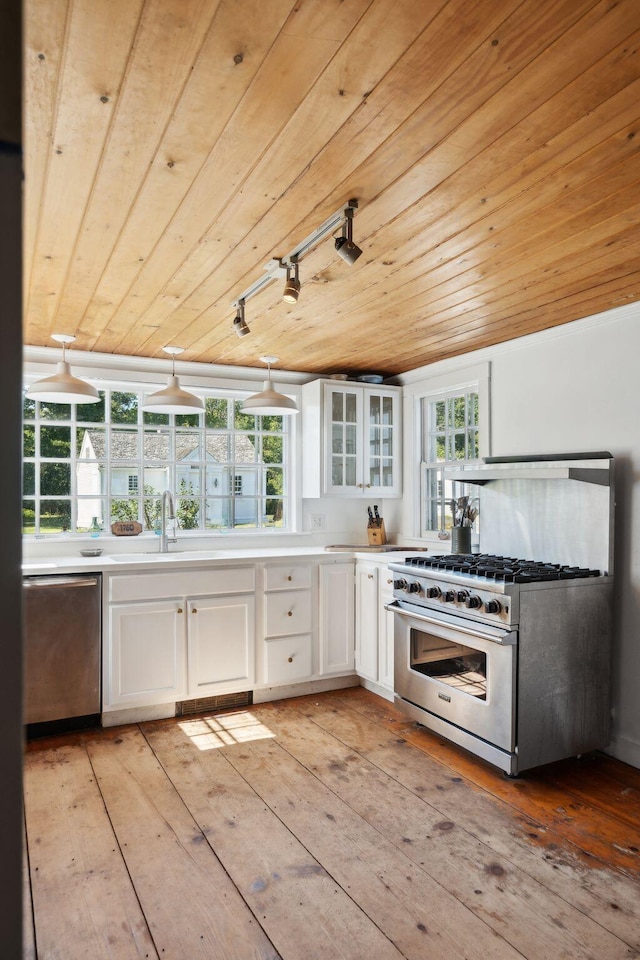 kitchen with wooden ceiling, hanging light fixtures, appliances with stainless steel finishes, white cabinets, and light wood-type flooring