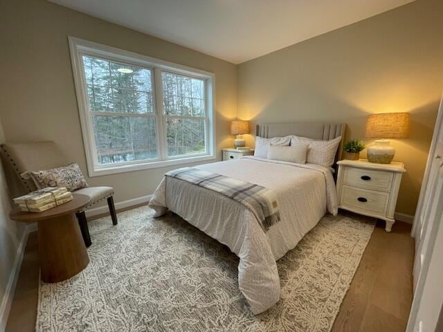 bedroom with light wood-type flooring